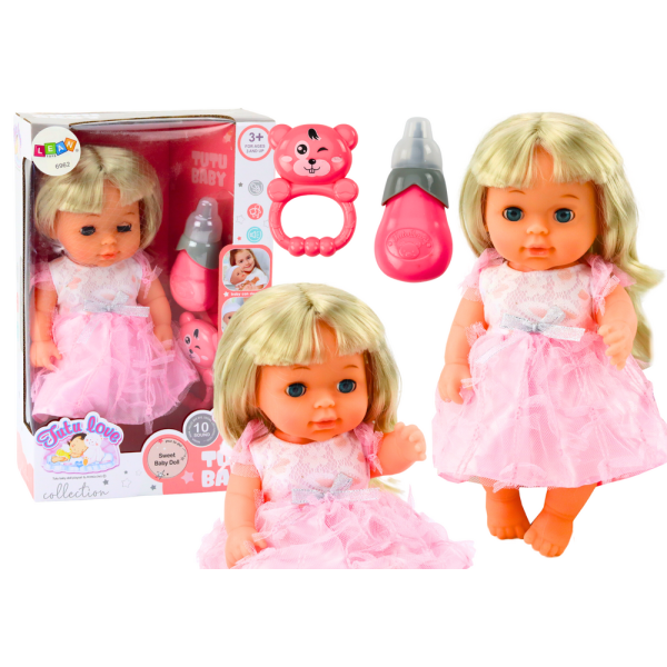 Lalka W Jasno-Różowej Sukience Siusiająca Butelka Grzechotka Dźwięki